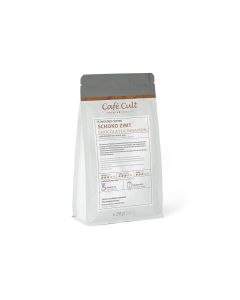 Verpakking Café Cult Schoko Zimt koffie van 250 gram op een witte achtergrond.