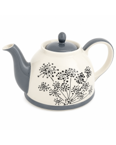 Crèmekleurige keramische theepot met grijze tuit, grijs deksel en zwart bloemmotief op een witte achtergrond.